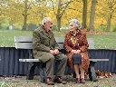 Vary___Add_two_elderly_people__80__years_old__sitting_naturally_on_the_existing_park_bench__facing_e kopie.webp