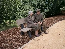 Vary___Add_two_elderly_people__80__years_old__sitting_naturally_on_the_existing_park_bench__facing_e(1) kopie.webp