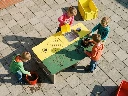CCVary_Image___4_school_kids__ages_5_to_7_yo__in_casual_colourfull_clothing_play_around_this_plastic_m kopie.webp